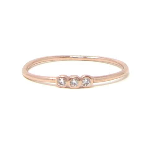 Rose gold three stone ring with cubic zirconia