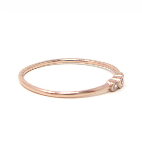 Rose gold three stone ring with cubic zirconia