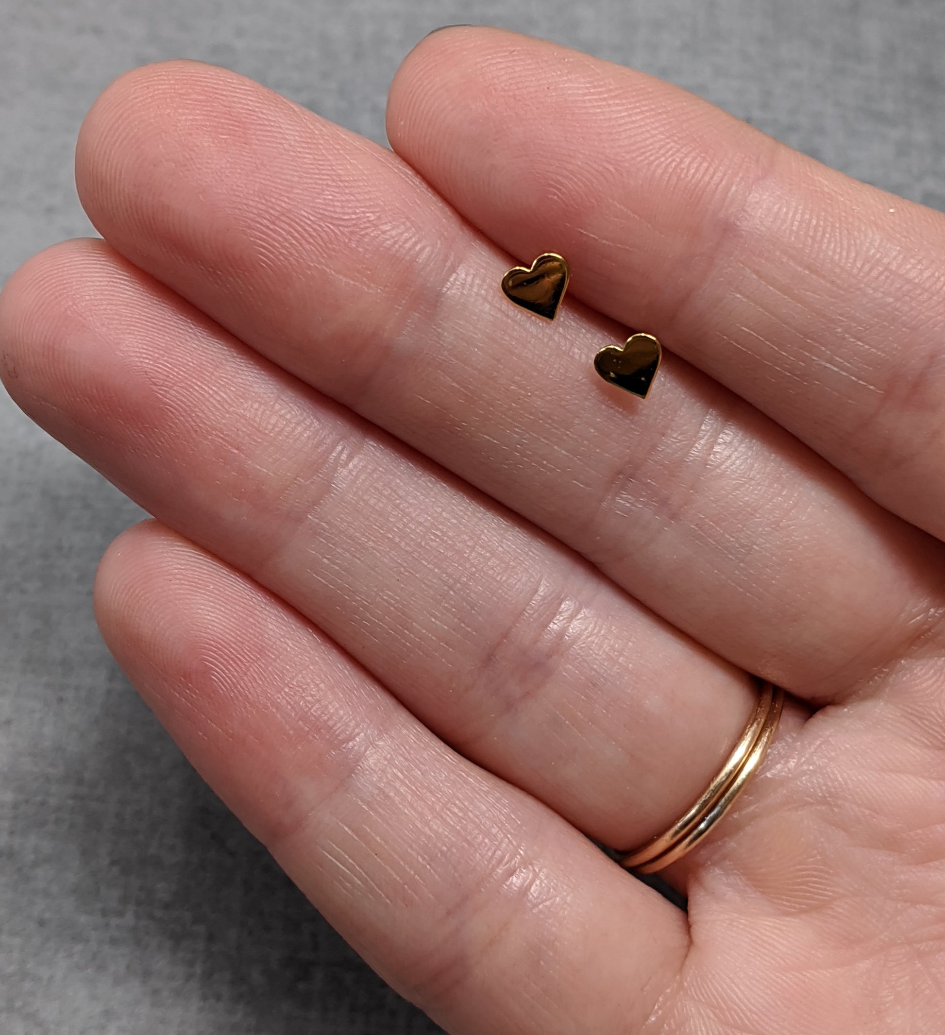 Yellow gold tiny heart studs