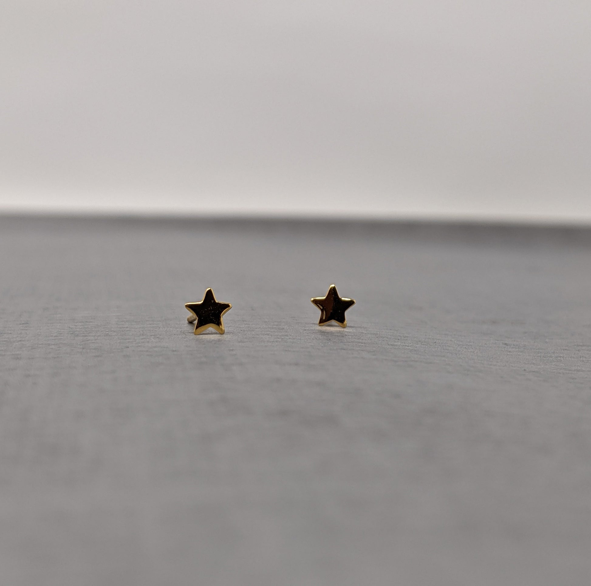 yellow gold star stud earrings